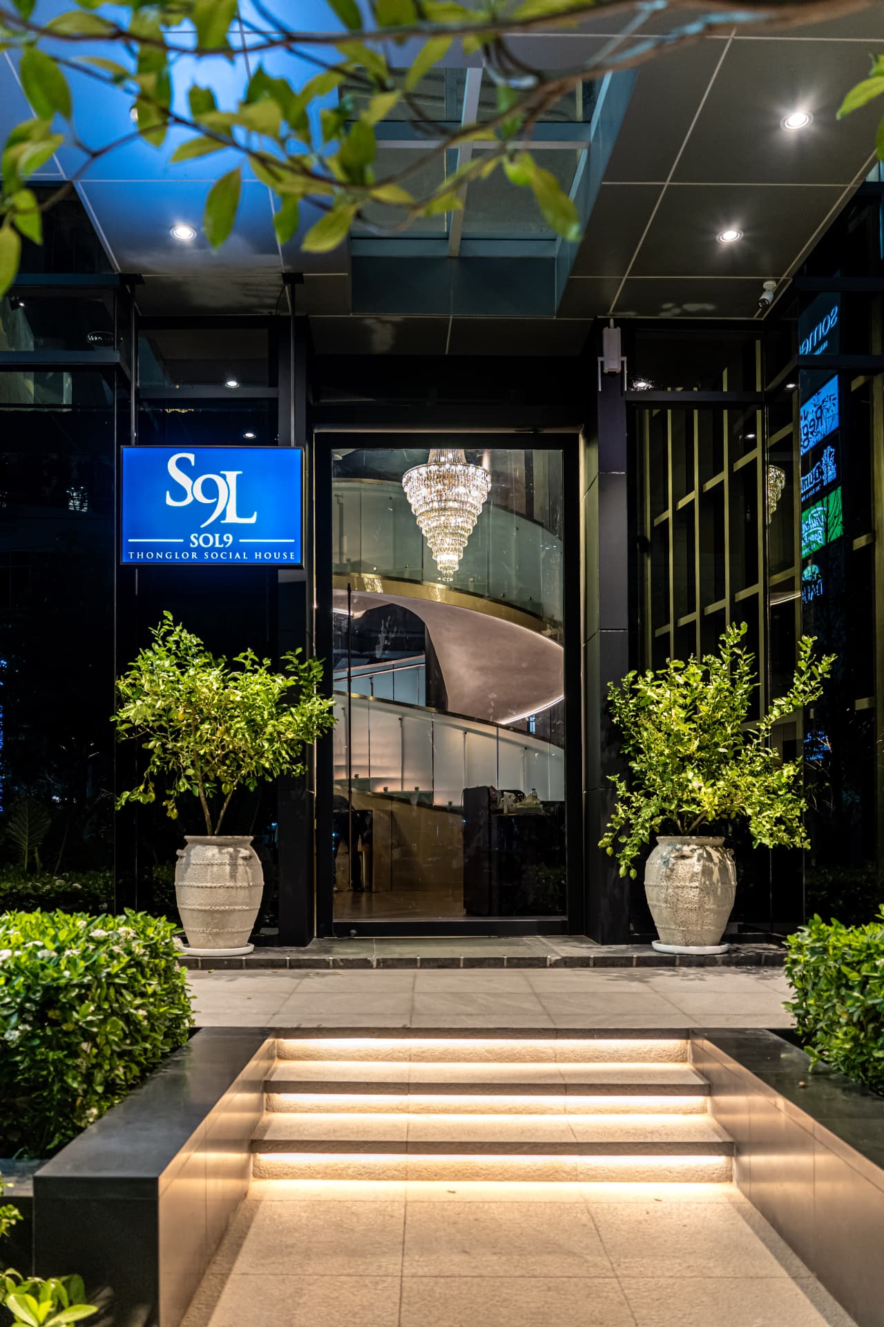 SOL9 entrance — illuminated doorway at Somerset Thong Lor